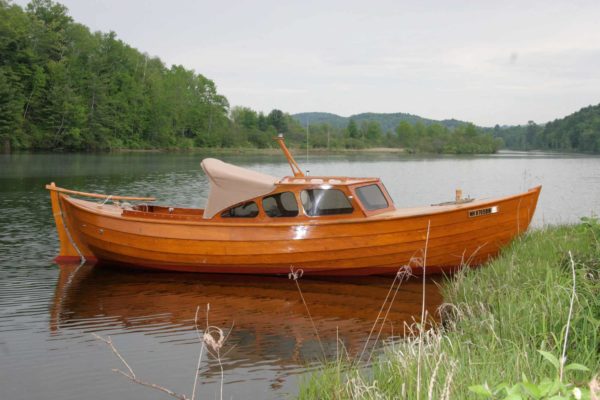 traditional boatworks snekke in water 600x400