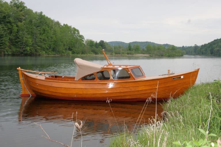 traditional boatworks snekke in water 768x512