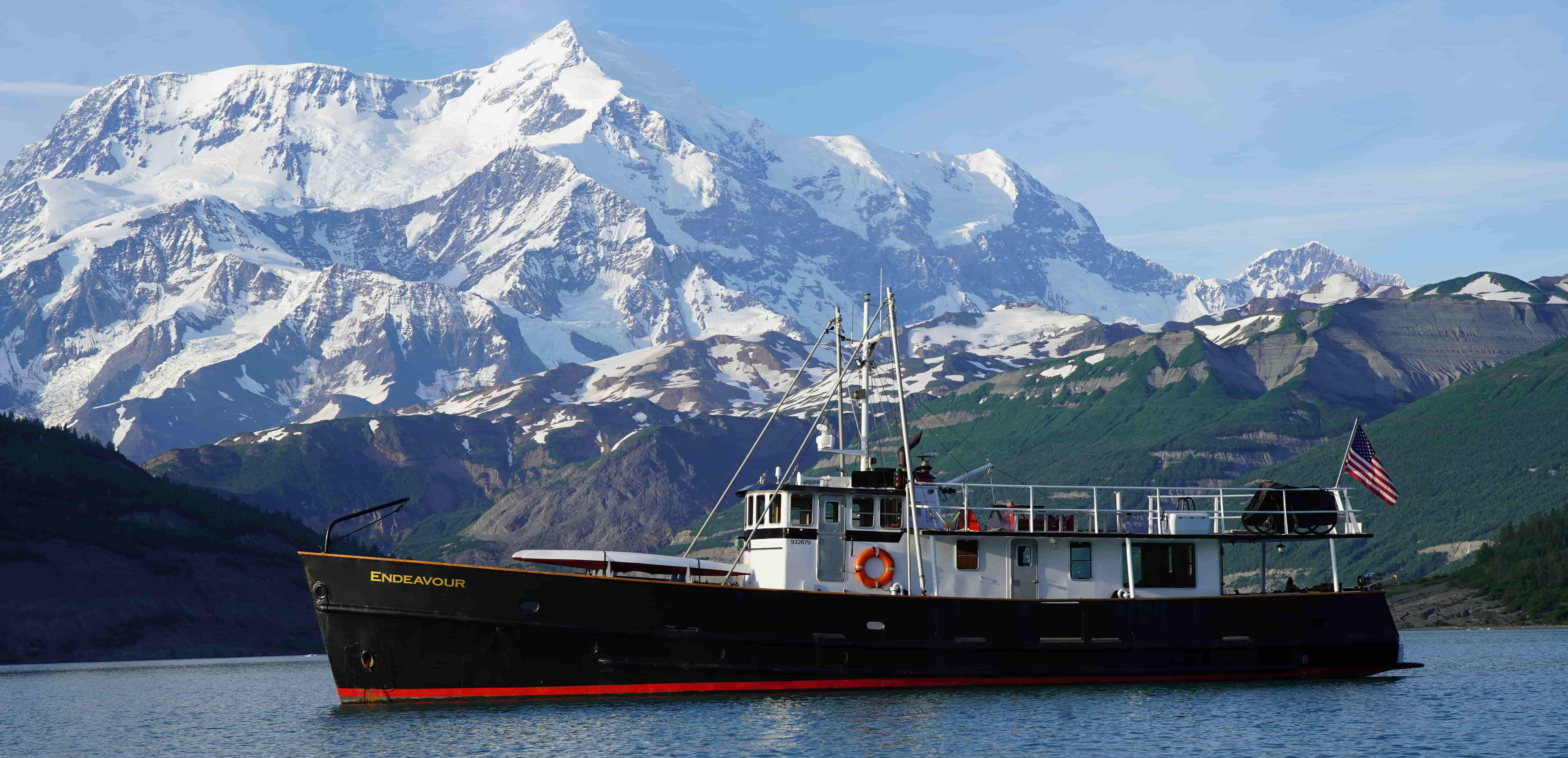 The Endeavour in Icy Bay with Mt St Elias in the background