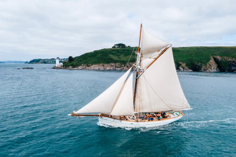 Pellew pilot cutter sailing along Cornish coastline 768x512